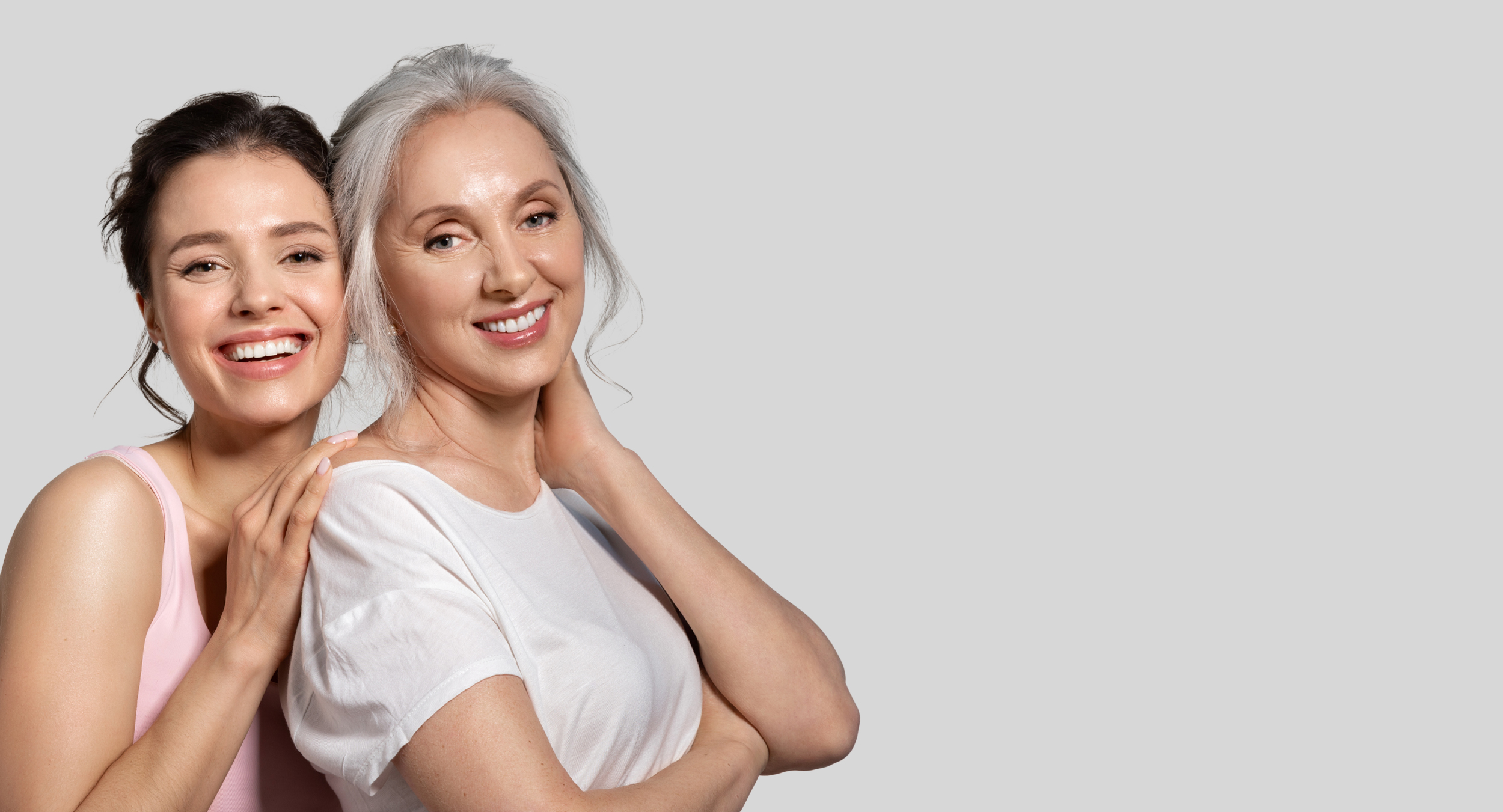 Two women with glowing, healthy skin